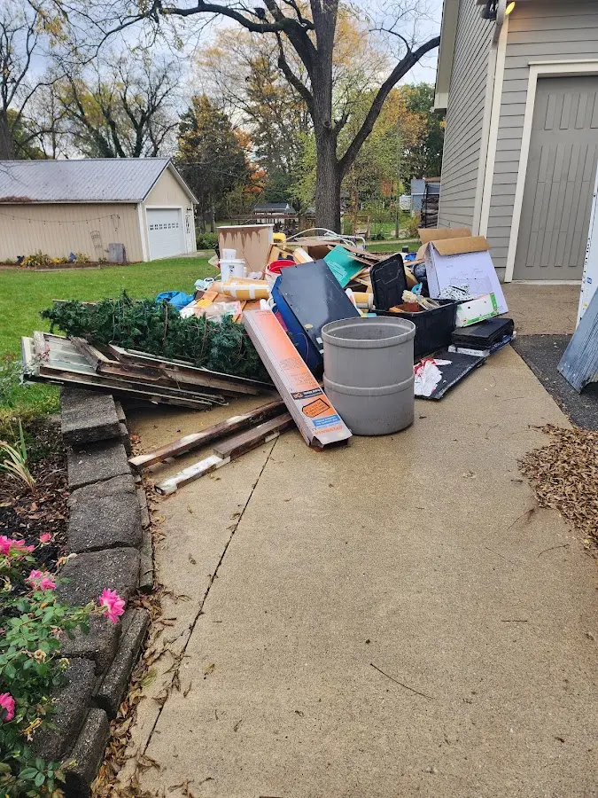 Dumpster being loaded with debris for Commercial Dumpster Rental in Bessemer